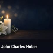 Illustration of a lit white candle and white lilies on a dark table, with text: Obituary: John Charles Huber